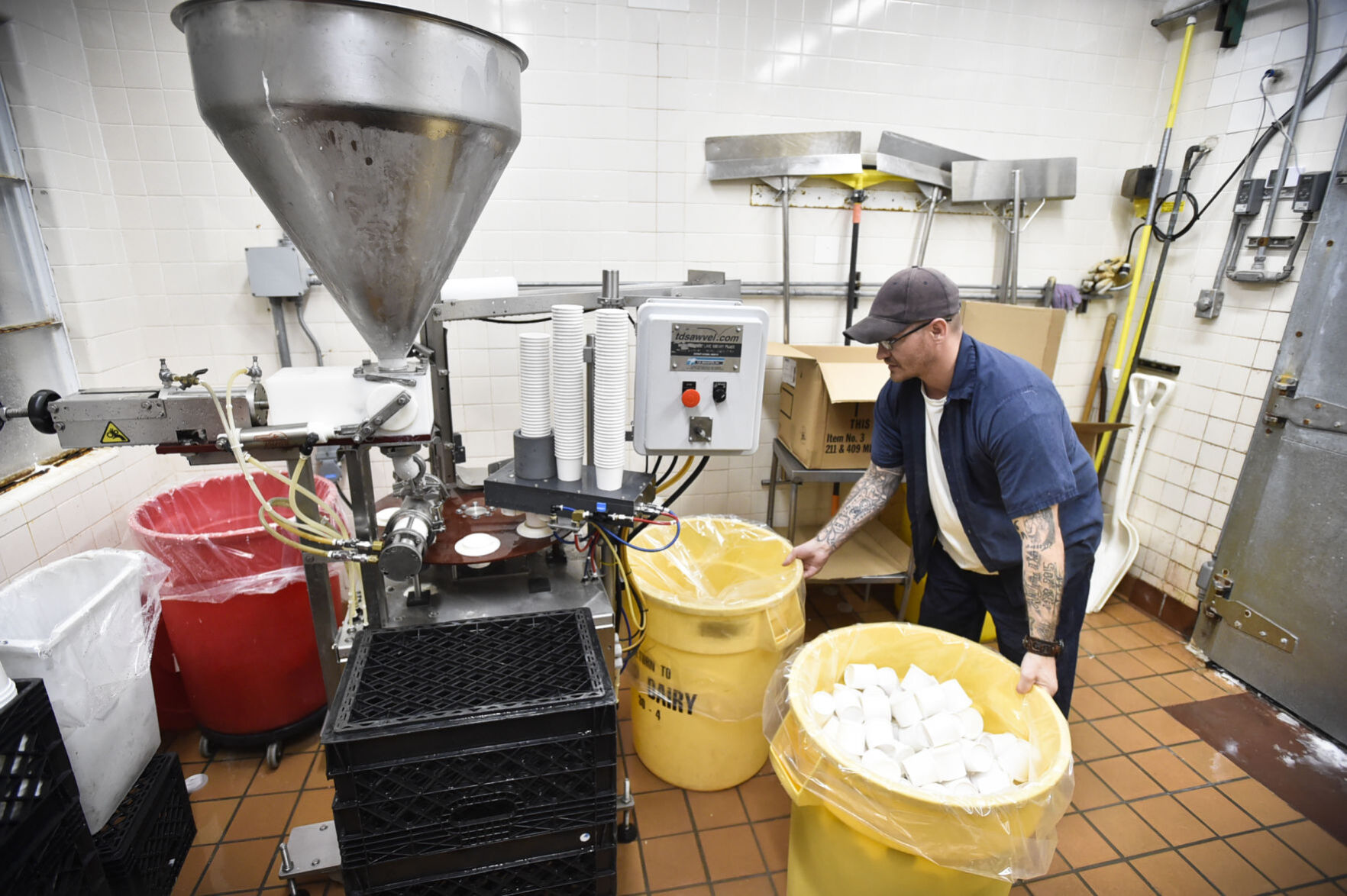 Inmate Billy Carter works at making vanilla ice cream